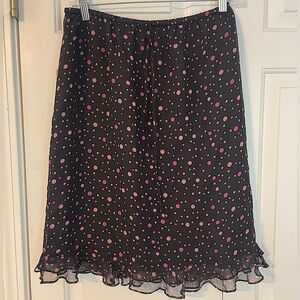 Silk skirt- black with dots of pink hues. Lovely flounced hem. Lined. M. EUC